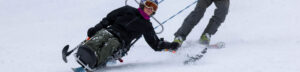 A Woman Skiing on a Snow Surfaces