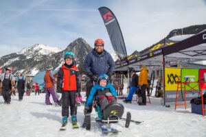 Father with two sons in the snow