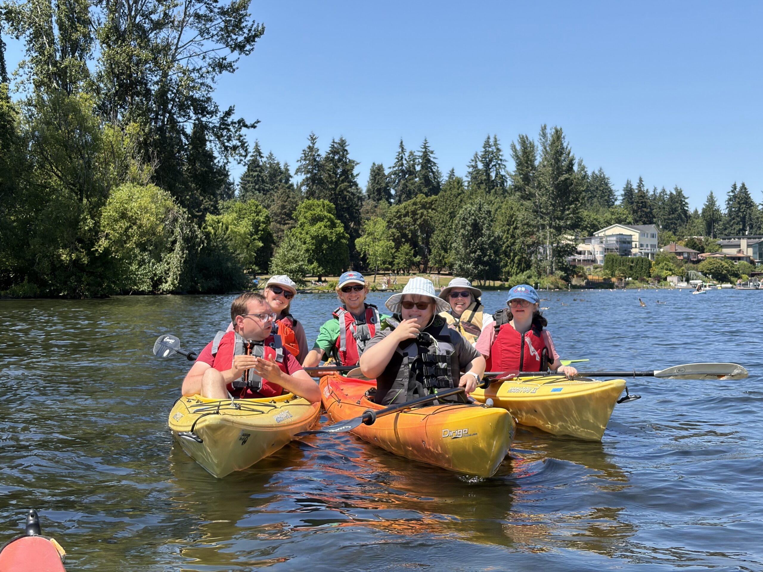 PTPs Sam, Sarina, and Faith kayaking with staff Caroline, Henry, and volunteer Monica